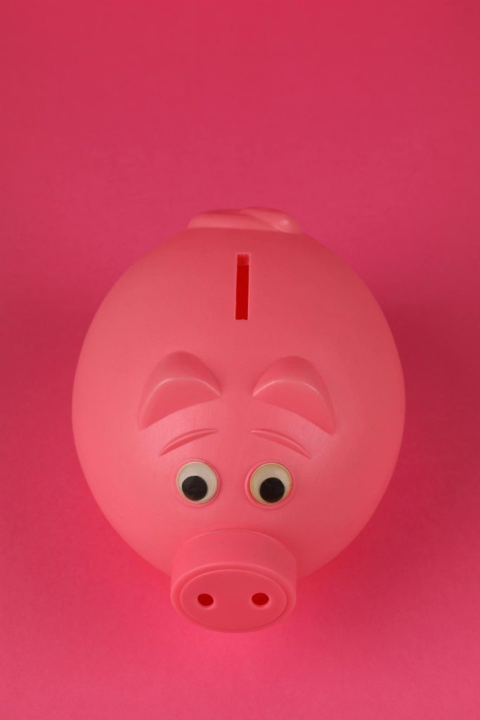 Pink piggy bank illustrating what are CDs and how a certificate of deposit grows your savings
